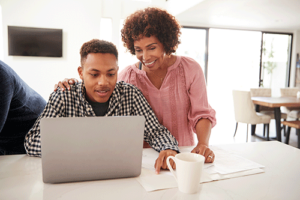 a parent and teen start the Family First admissions process on a laptop