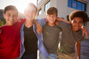 a group of boys embrace at one of many residential treatment centers for youth