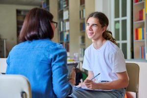 a teen learns coping skills in mental health treatment