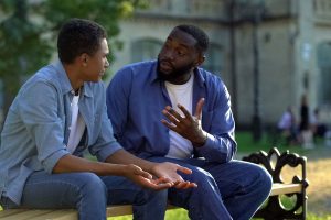 a father talks to his son after learning about parenting a neurodivergent child