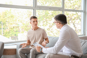 a teen talks with a therapist about relapse prevention activities