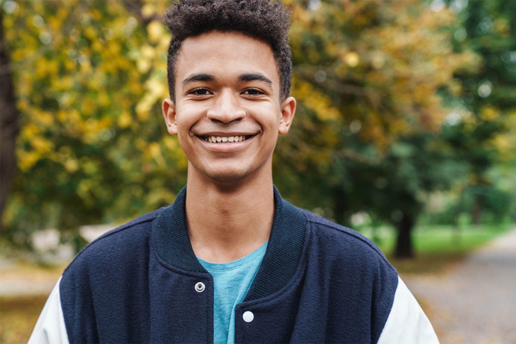 a teen smiles about his medication for bipolar disorder