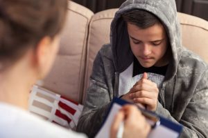 a teen looks stressed during adolescent anxiety treatment 