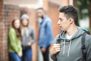 a boy looks nervous in front of others and may need tips for social anxiety in teens