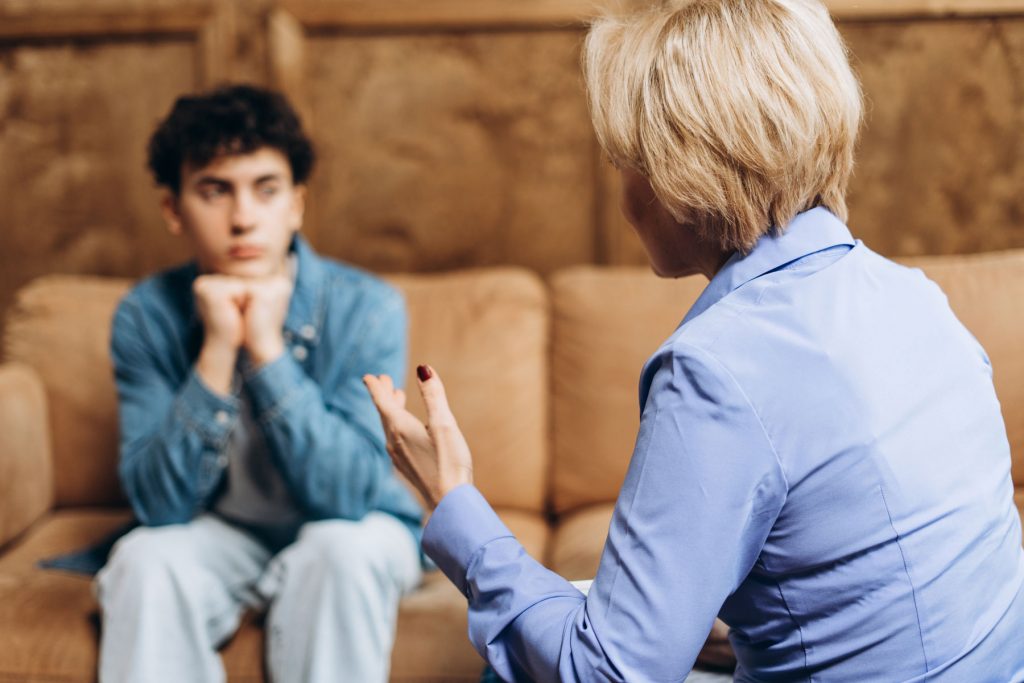 a teen listens to a therapist talk about unresolved trauma