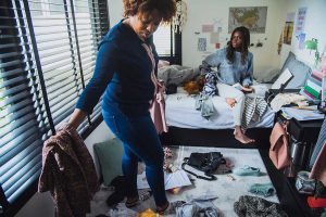 a mother looks around her daughter's messy room with her thinking of the connection between messy rooms and depression