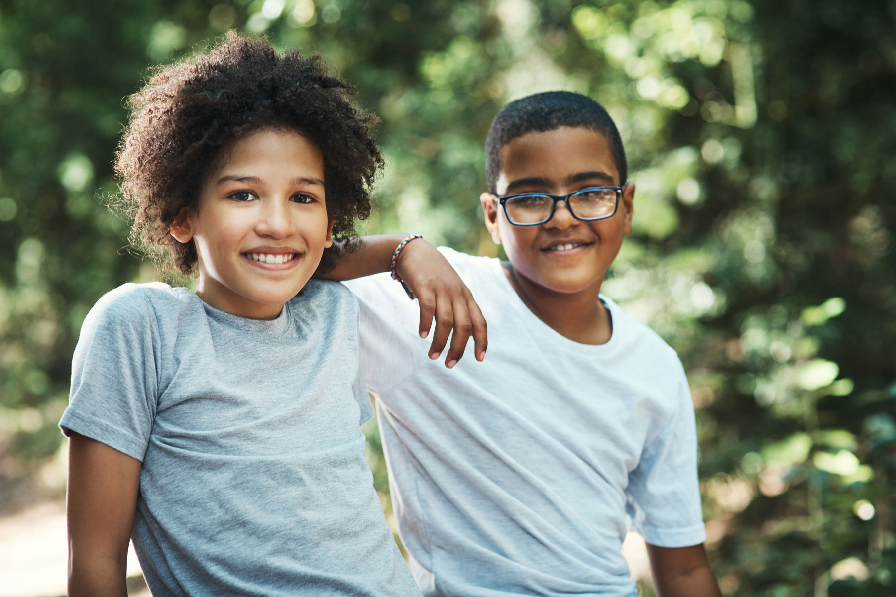 two teen boys smile at a mental health summer program