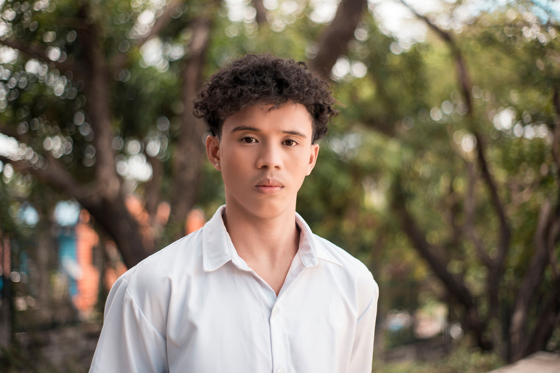 a teen looks apathetic, maybe why his parents wonder how to deal with a teenager that doesn't care
